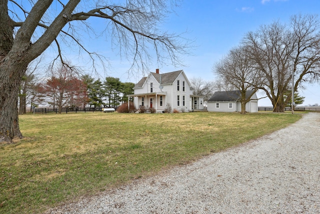 view of property exterior featuring covered porch and a yard