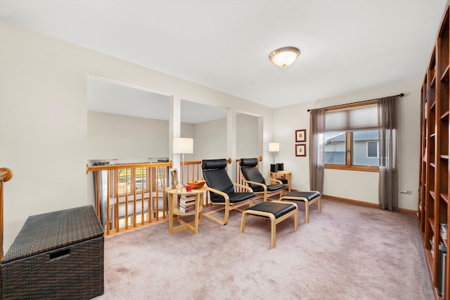 living area featuring carpet floors