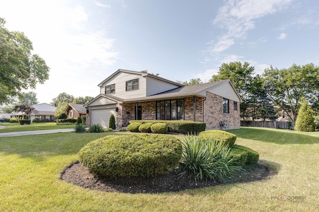 front of property featuring a garage and a front yard