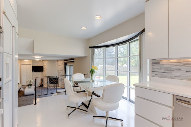 dining space featuring light tile patterned floors