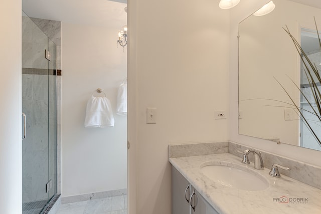 bathroom featuring vanity and a shower with shower door