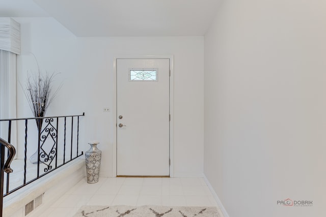 entrance foyer with light tile patterned floors