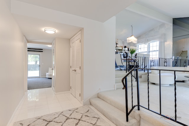 hall featuring vaulted ceiling with beams and light colored carpet