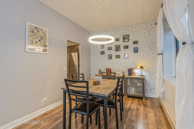 dining space with a notable chandelier and dark wood-type flooring