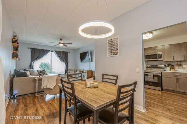 dining room featuring hardwood / wood-style flooring and ceiling fan