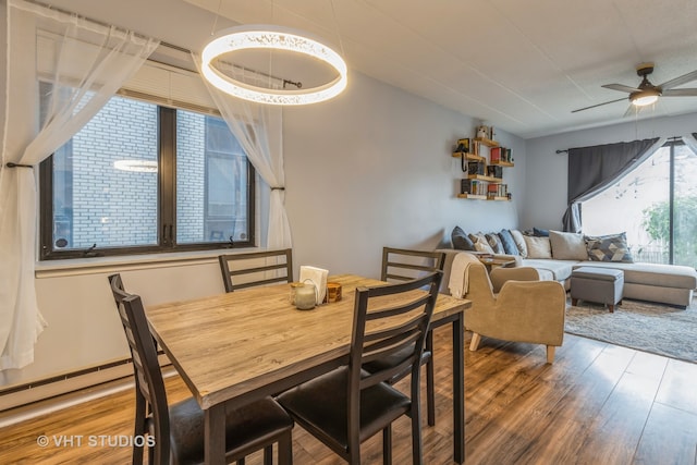 dining room featuring ceiling fan and hardwood / wood-style flooring