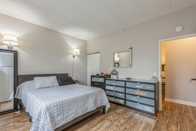 bedroom with wood-type flooring