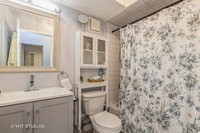 full bathroom featuring vanity, toilet, and shower / bath combo with shower curtain