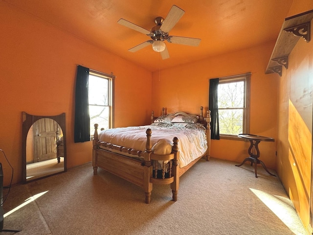 carpeted bedroom with ceiling fan