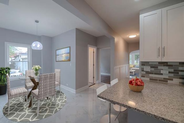 dining space featuring a wealth of natural light