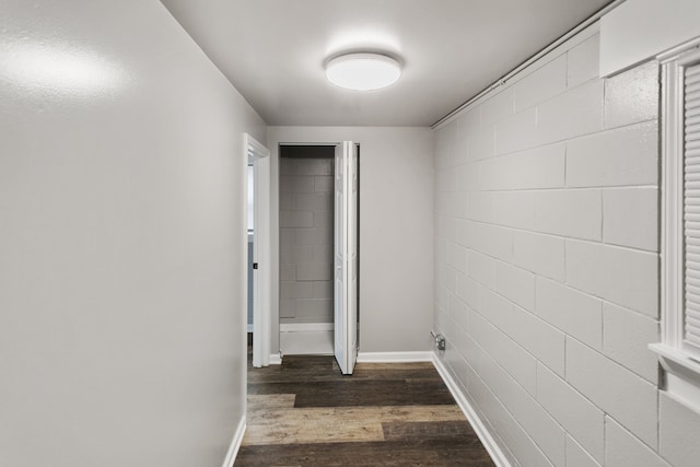 corridor with dark hardwood / wood-style floors