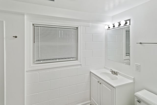 bathroom with vanity and toilet