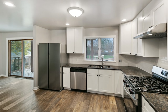 kitchen featuring dark wood-type flooring, sink, white cabinets, and stainless steel appliances