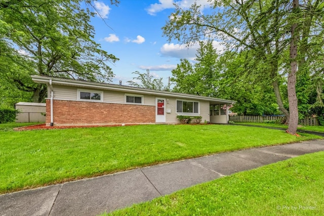 ranch-style home with a front lawn