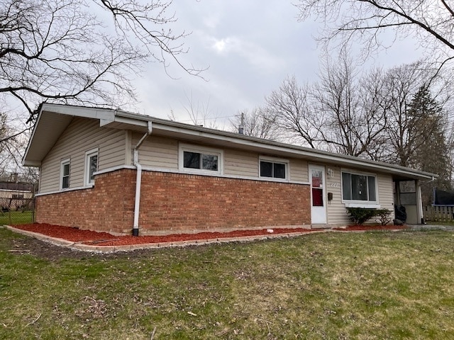 ranch-style home with a front lawn