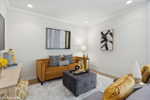 living room with light hardwood / wood-style floors and ornamental molding