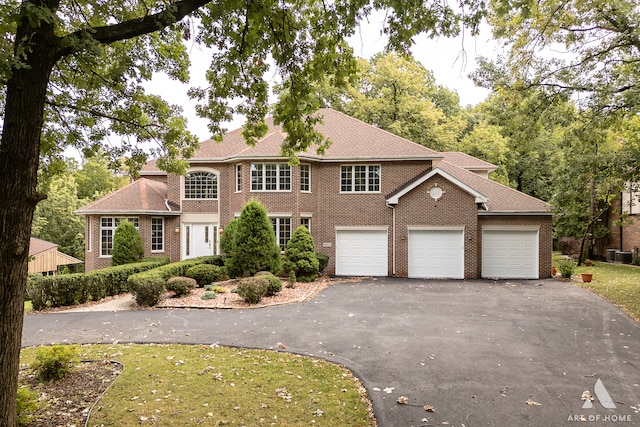 colonial-style house featuring central AC