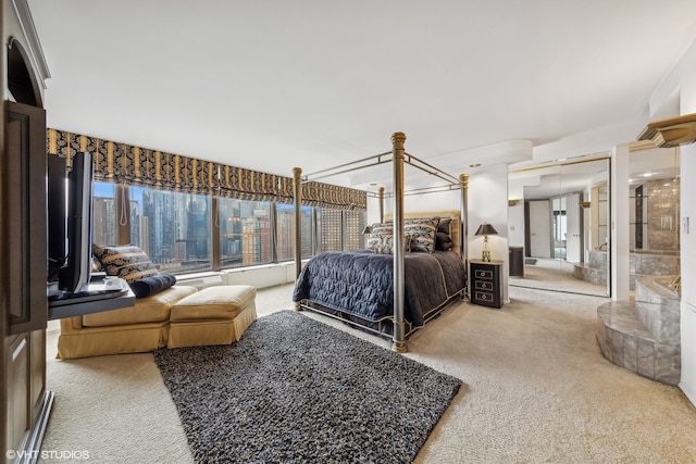 bedroom featuring carpet flooring and multiple windows