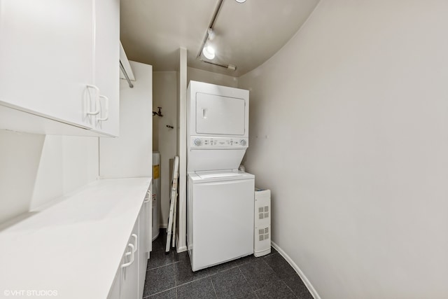 clothes washing area with stacked washer / drying machine