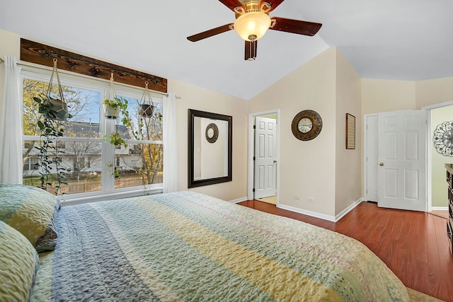 bedroom featuring hardwood / wood-style flooring, ceiling fan, and vaulted ceiling