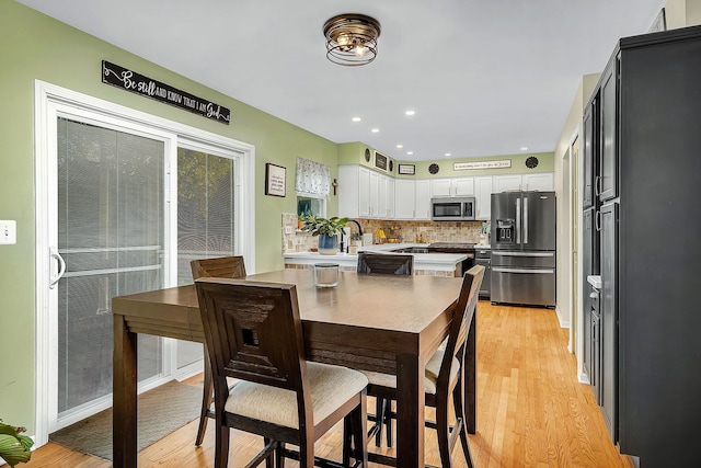 dining area with light wood-type flooring