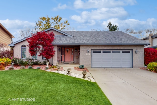 ranch-style house featuring a front yard and a garage