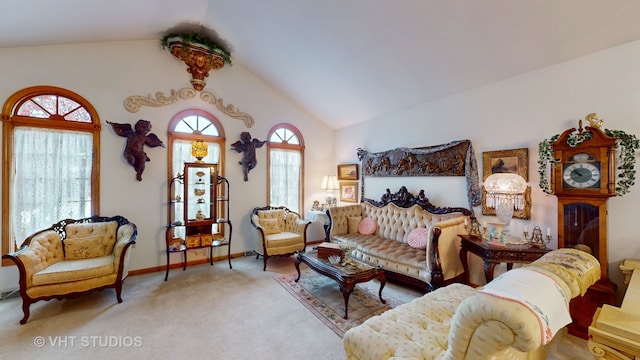 carpeted living room with plenty of natural light and vaulted ceiling