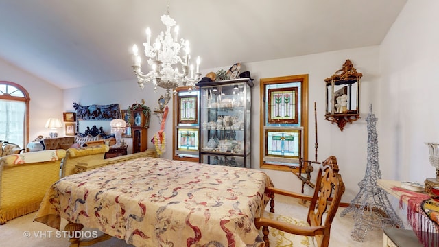 bedroom featuring carpet, lofted ceiling, and a notable chandelier