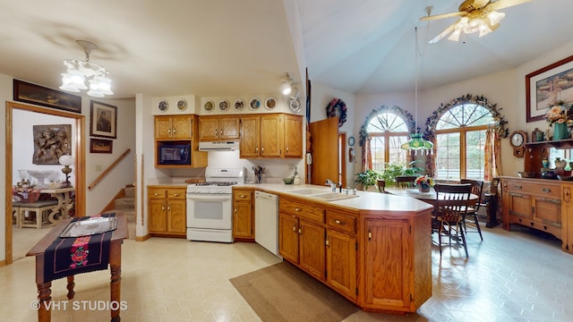 kitchen featuring kitchen peninsula, white appliances, sink, hanging light fixtures, and lofted ceiling