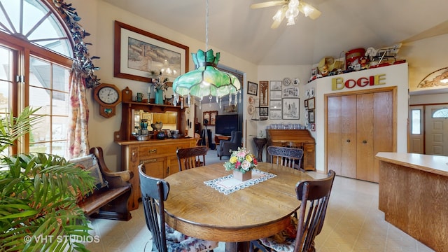 dining room featuring ceiling fan and lofted ceiling