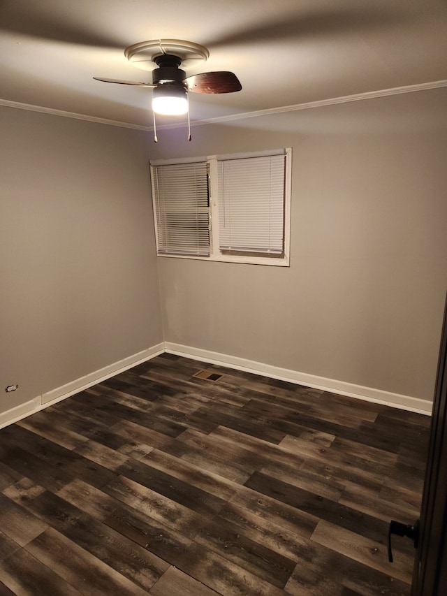 empty room with dark hardwood / wood-style floors, ceiling fan, and crown molding