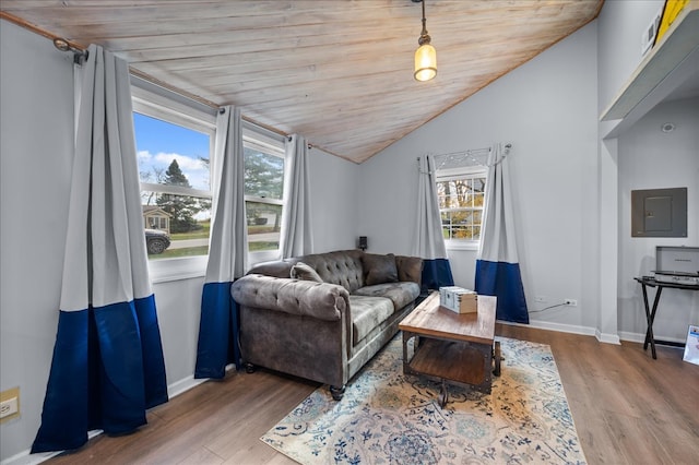 living room with hardwood / wood-style flooring, wooden ceiling, electric panel, and vaulted ceiling