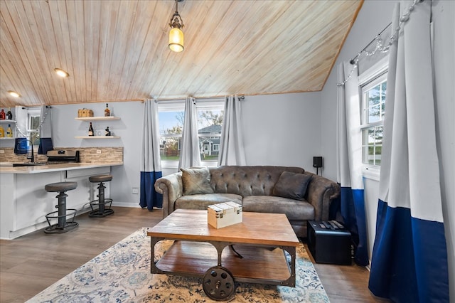 living room featuring a wealth of natural light, wood ceiling, vaulted ceiling, and light hardwood / wood-style floors