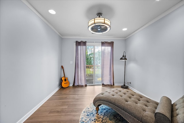 bedroom with access to outside, ornamental molding, and light wood-type flooring