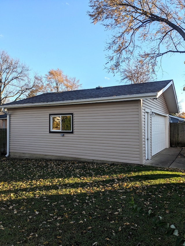 garage featuring a lawn