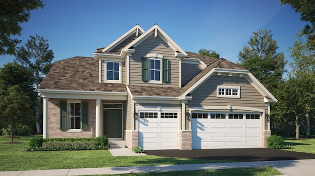 craftsman house featuring a front lawn and a garage