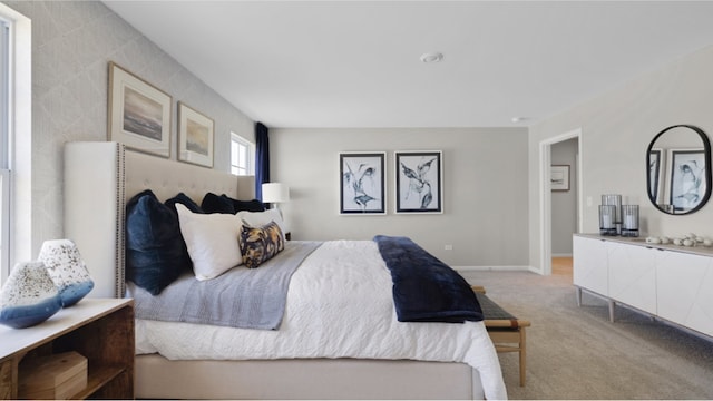 bedroom featuring light colored carpet