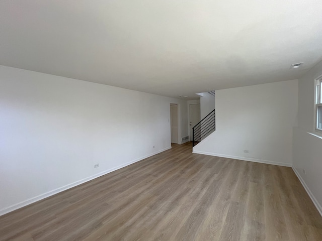 unfurnished living room with light hardwood / wood-style floors