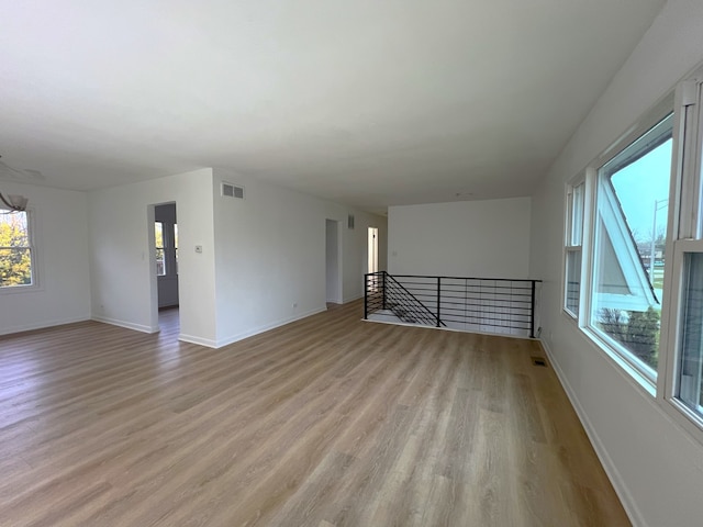 unfurnished room with light hardwood / wood-style flooring