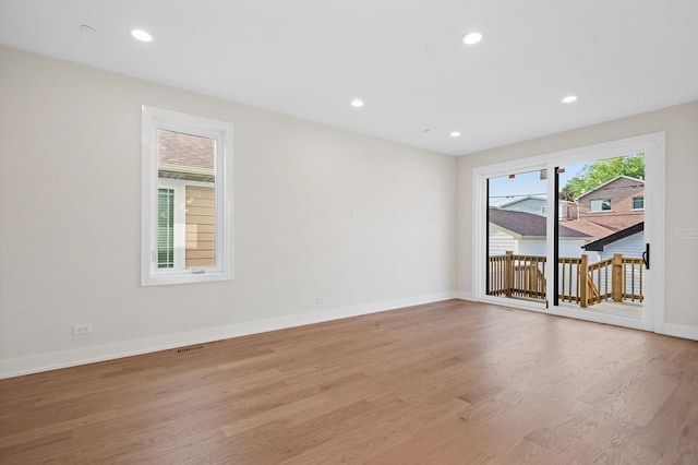 spare room featuring light hardwood / wood-style floors