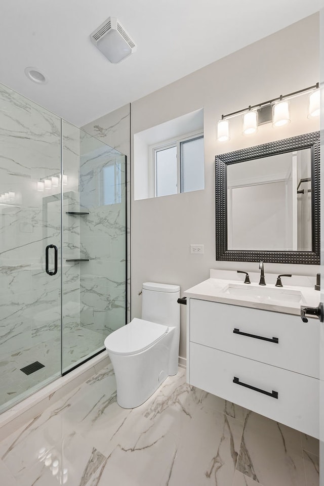 bathroom with an enclosed shower, vanity, and toilet