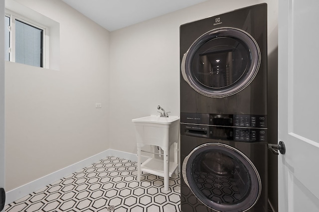 laundry area with stacked washer / dryer