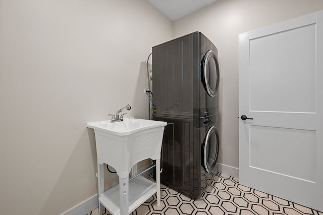 laundry area featuring stacked washer / dryer