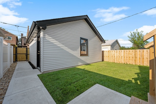 view of property exterior featuring a lawn