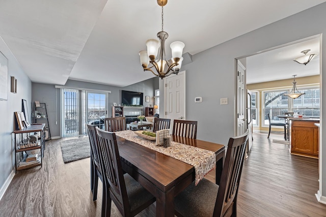 dining room featuring a chandelier and light hardwood / wood-style floors