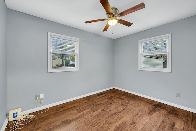 empty room with wood-type flooring and ceiling fan