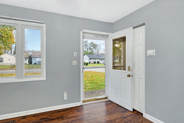 entryway with dark wood-type flooring