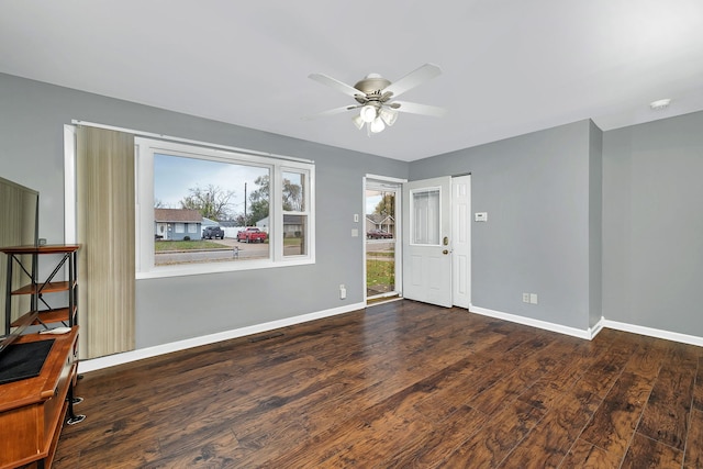 empty room featuring dark hardwood / wood-style floors and ceiling fan