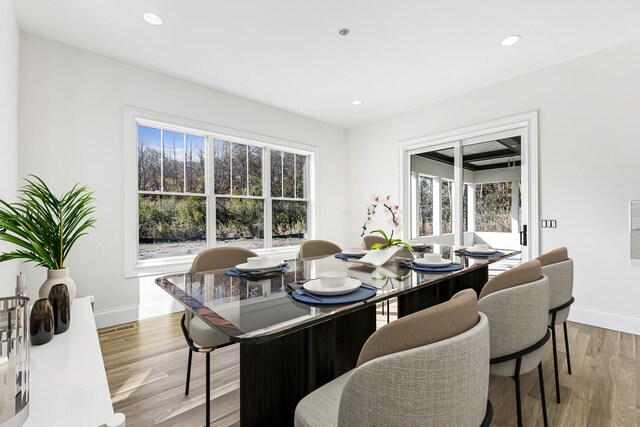 dining space featuring light wood-type flooring