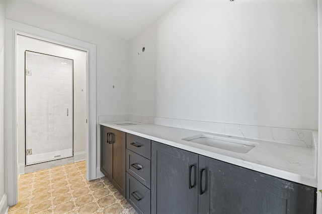 interior space with light stone countertops, dark brown cabinets, and sink